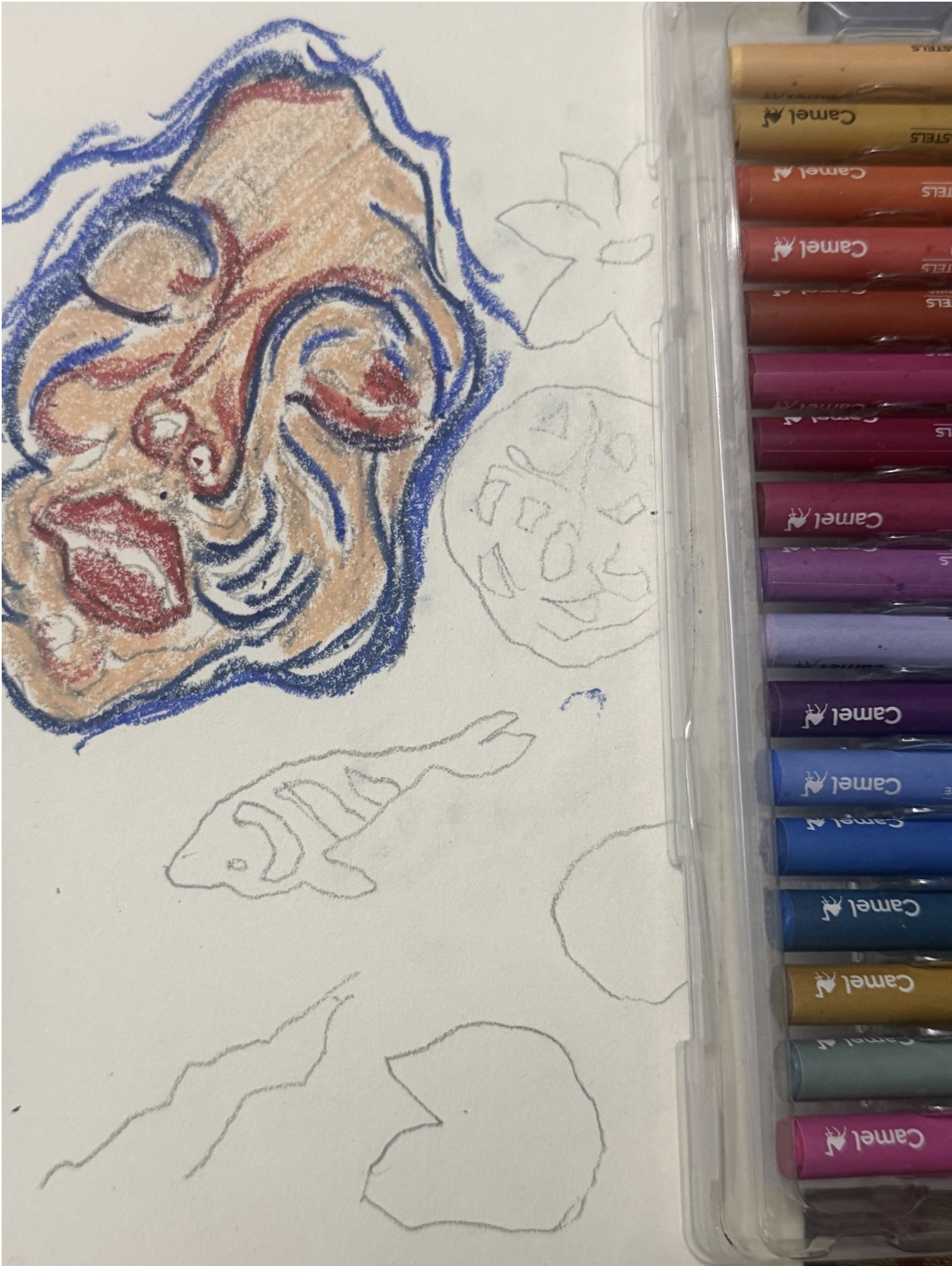 First strokes: the face blocked in with blue, red and skin-colored oil pastel, while the koi, lily pads and flower are still pencil outlines